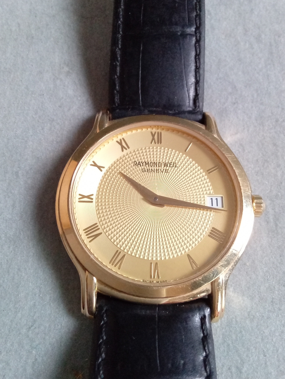 Raymond Weil Gold Dial Black Leather Strap Men’s Watch